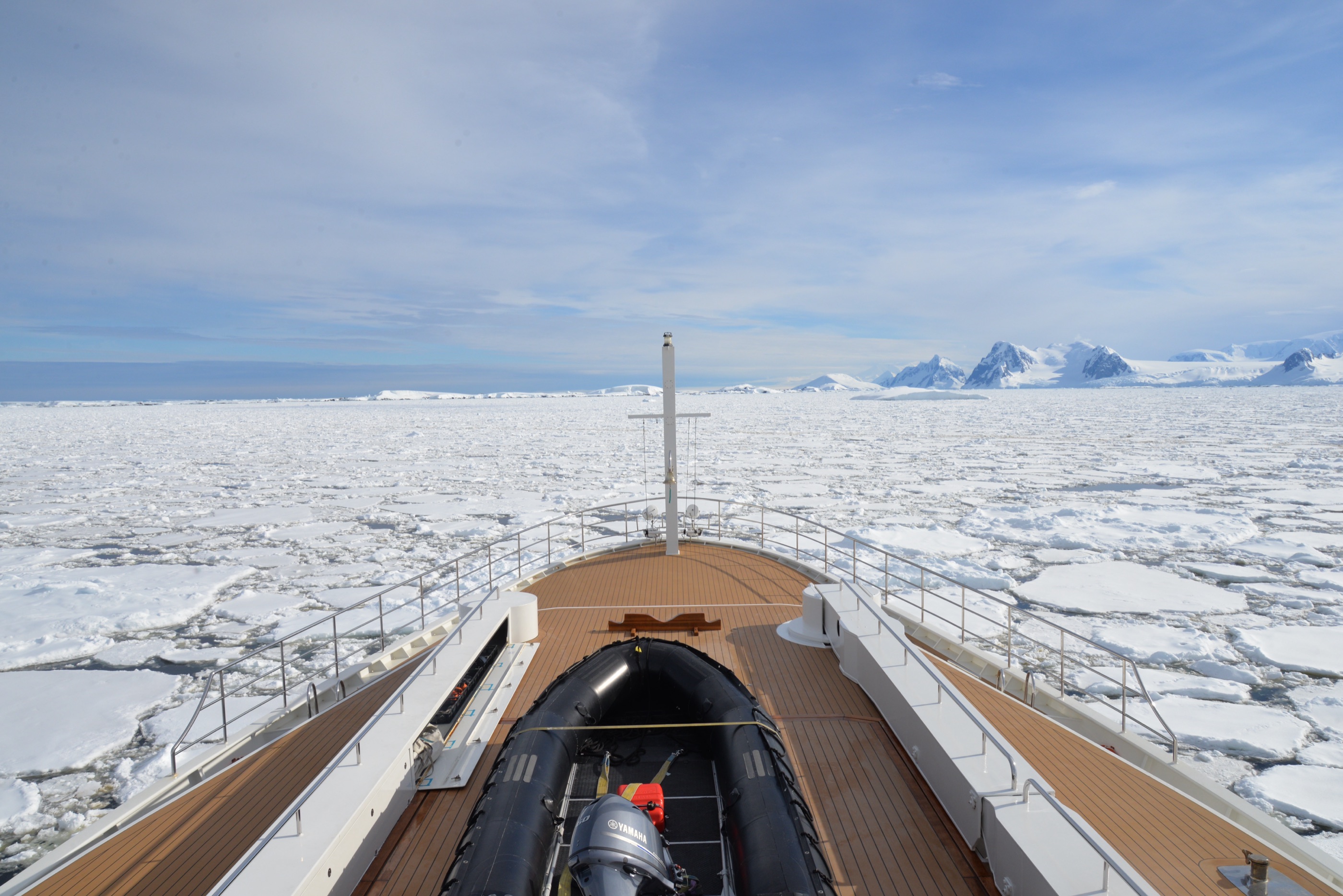Bow view over pack ice with a Zodiac stowed forward